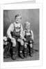 Two brothers pose for a childhood portrait in Germany, ca. 1949 by Anonymous