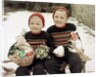 Two brothers sit with Easter decorations outside in Germany, ca. 1948 by Anonymous