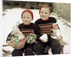 Two brothers sit with Easter decorations outside in Germany, ca. 1948 by Anonymous