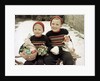 Two brothers sit with Easter decorations outside in Germany, ca. 1948 by Anonymous