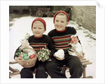 Two brothers sit with Easter decorations outside in Germany, ca. 1948 by Anonymous