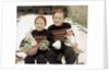 Two brothers sit with Easter decorations outside in Germany, ca. 1948 by Anonymous