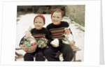 Two brothers sit with Easter decorations outside in Germany, ca. 1948 by Anonymous