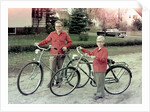 Two brothers stand with their new bikes in Wisconsin, ca. 1953 by Anonymous