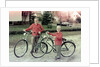 Two brothers stand with their new bikes in Wisconsin, ca. 1953 by Anonymous