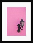 Street lamp on pink wall of Colonial style building by Anonymous