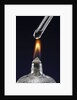 Test tube with liquid, over flame by Anonymous