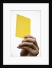Hand holding yellow card by Anonymous