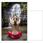Woman meditating in front of a waterfall by Anonymous