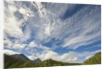 Cumulus and cirrus clouds above mountains by Anonymous