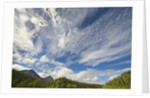 Cumulus and cirrus clouds above mountains by Anonymous