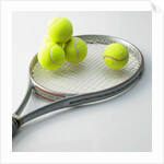 A tennis racket and balls by Anonymous