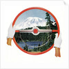 Steering wheel with image of woods and snow-covered mountain by Anonymous
