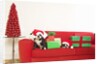 Dogs and Christmas gifts on sofa by Corbis