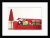 Dogs and Christmas gifts on sofa by Corbis