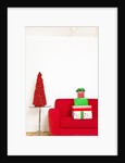 Stack of Christmas gifts on sofa by Anonymous