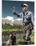 Man fly fishing with dog by Anonymous