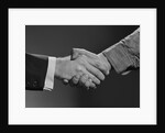 Close-up handshake between businessman and laborer by Anonymous