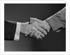 Close-up handshake between businessman and laborer by Anonymous