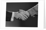 Close-up handshake between businessman and laborer by Anonymous