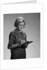 Blond woman secretary teacher taking notes by Anonymous