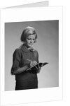 Blond woman secretary teacher taking notes by Anonymous