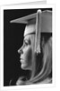 Profile blond female graduate wearing white mortarboard by Anonymous