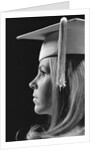 Profile blond female graduate wearing white mortarboard by Anonymous