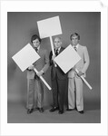 Trio of businessmen carrying blank signs by Anonymous