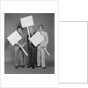 Trio of businessmen carrying blank signs by Anonymous