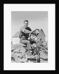 Smiling man farmer driving tractor by Anonymous