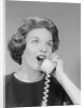 Excited woman talking on telephone by Anonymous