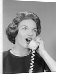 Excited woman talking on telephone by Anonymous