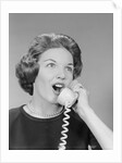 Excited woman talking on telephone by Anonymous