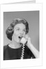 Excited woman talking on telephone by Anonymous