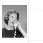 Excited woman talking on telephone by Anonymous