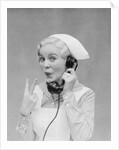 Smiling blond nurse with surprised expression talking on telephone holding up two fingers by Anonymous