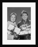 Couple man and woman holding wrapped christmas presents and packages by Anonymous