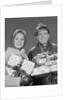 Couple man and woman holding wrapped christmas presents and packages by Anonymous
