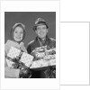 Couple man and woman holding wrapped christmas presents and packages by Anonymous