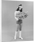 Young woman wearing santa claus hat hot pants go-go boots holding wrapped christmas presents by Anonymous