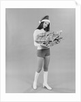Young woman wearing santa claus hat hot pants go-go boots holding wrapped christmas presents by Anonymous