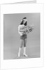 Young woman wearing santa claus hat hot pants go-go boots holding wrapped christmas presents by Anonymous