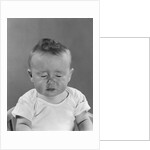 Portrait baby with eyes tightly closed by Anonymous