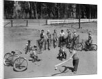 10 neighborhood boys playing sand lot baseball most wear blue jeans tee shirts by Anonymous