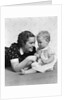 Woman mother smiling sitting playing with baby daughter by Anonymous