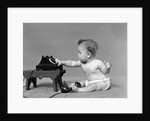 Baby in diaper dialing telephone by Anonymous