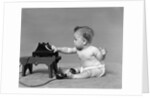 Baby in diaper dialing telephone by Anonymous
