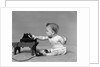 Baby in diaper dialing telephone by Anonymous