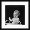 Baby in high chair making shrugging gesture by Anonymous